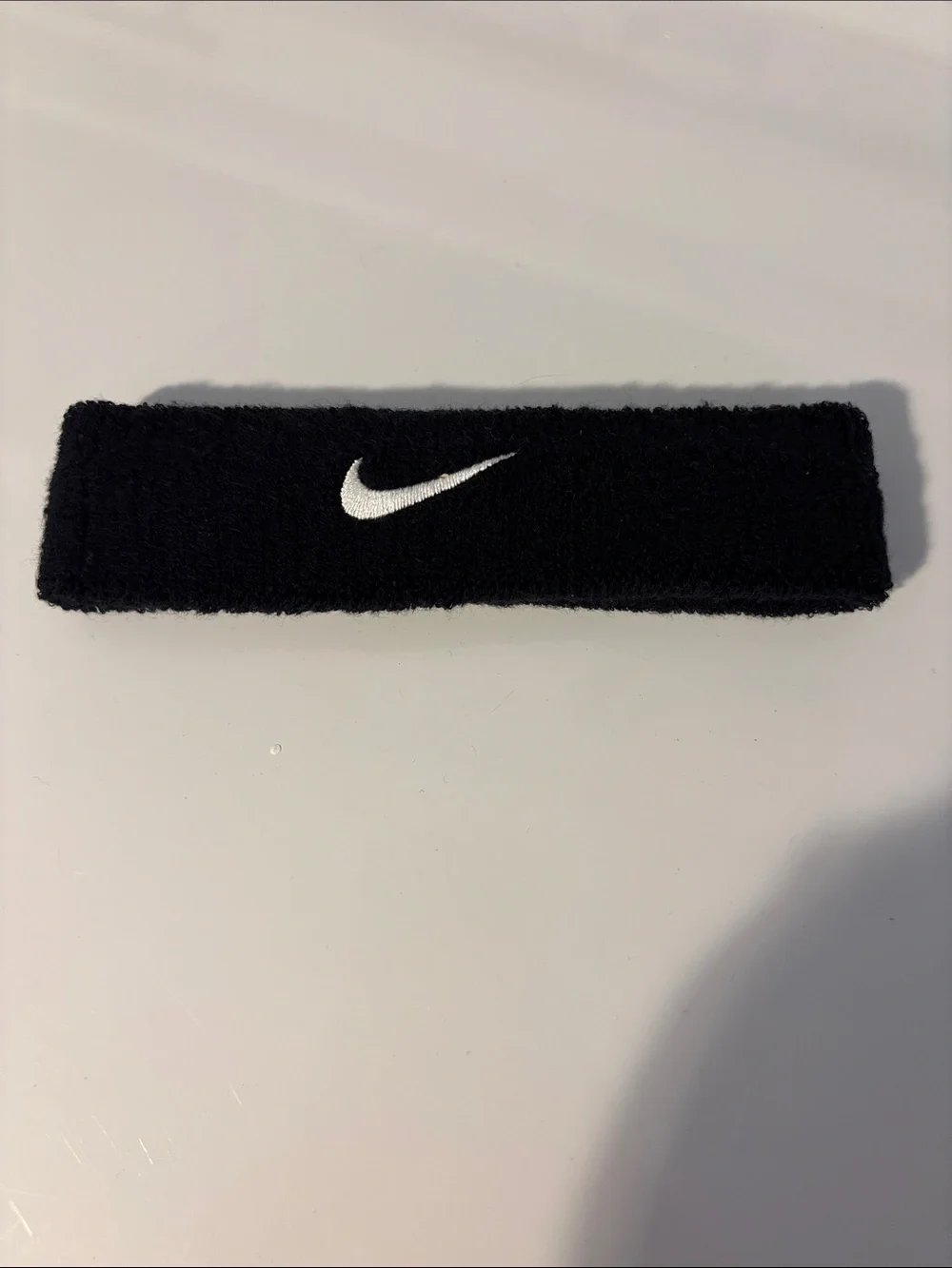 Nike Black Terry Sweatband with White Swoosh Logo